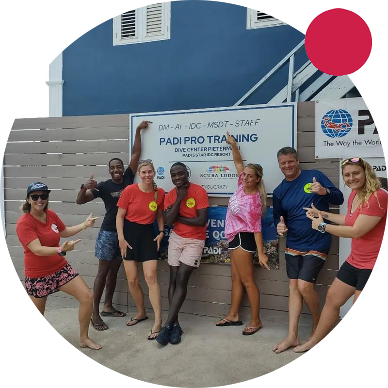 Group of staff and divers on dive trip in the tropics.